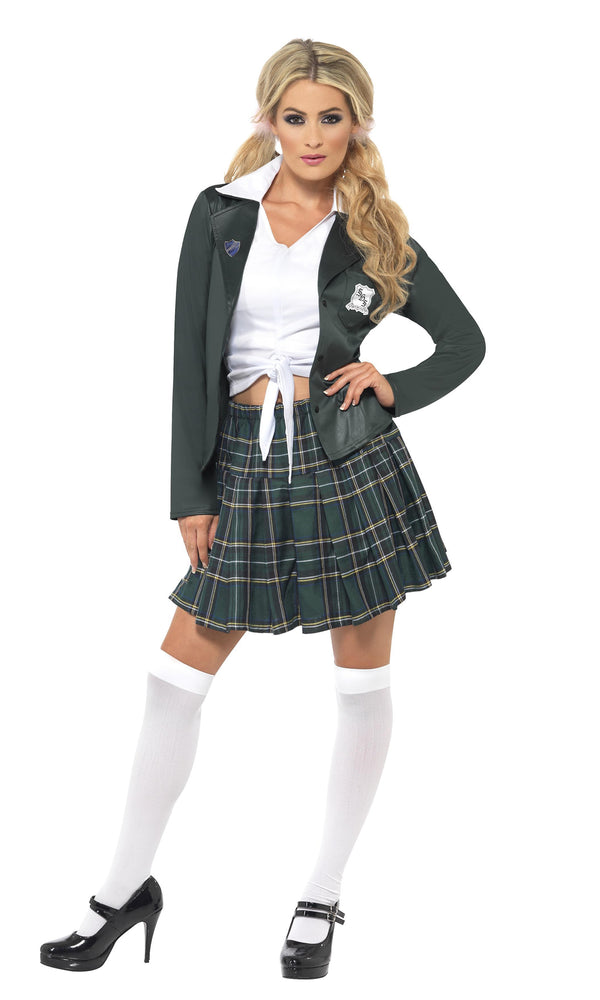 A woman modeling a school girl costume, wearing a plaid skirt, a white shirt and dark blazer.