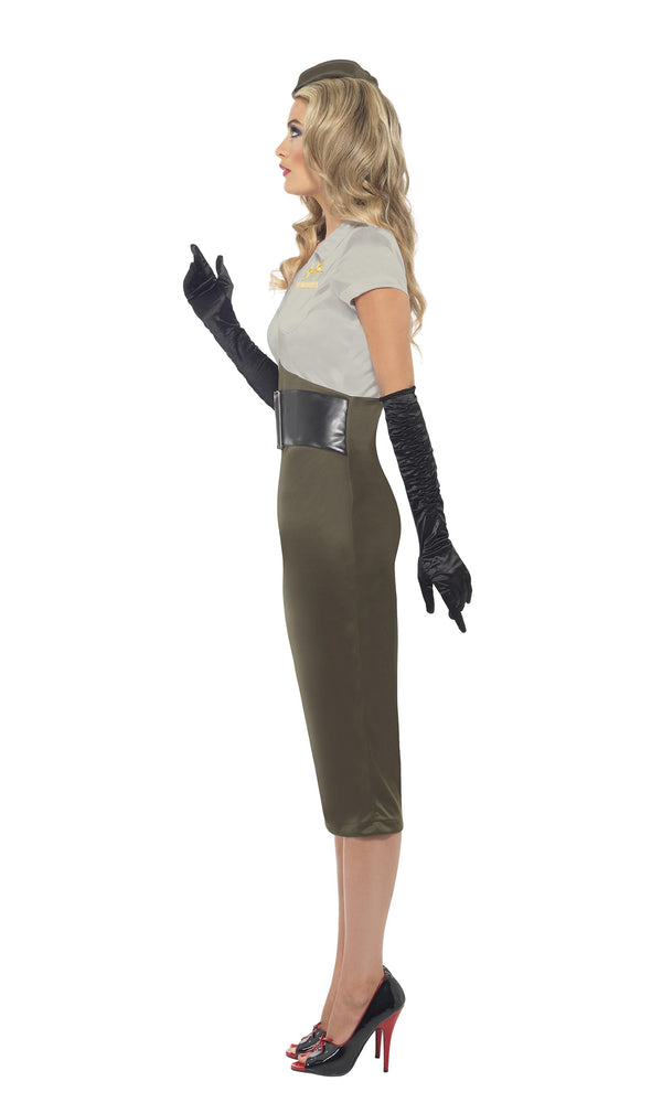 A WWII-themed costume featuring a green dress with an attached belt, and gloves, worn by a woman standing sideways