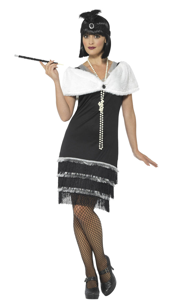 Black flapper dress with silver trim, white fur stole and black headband