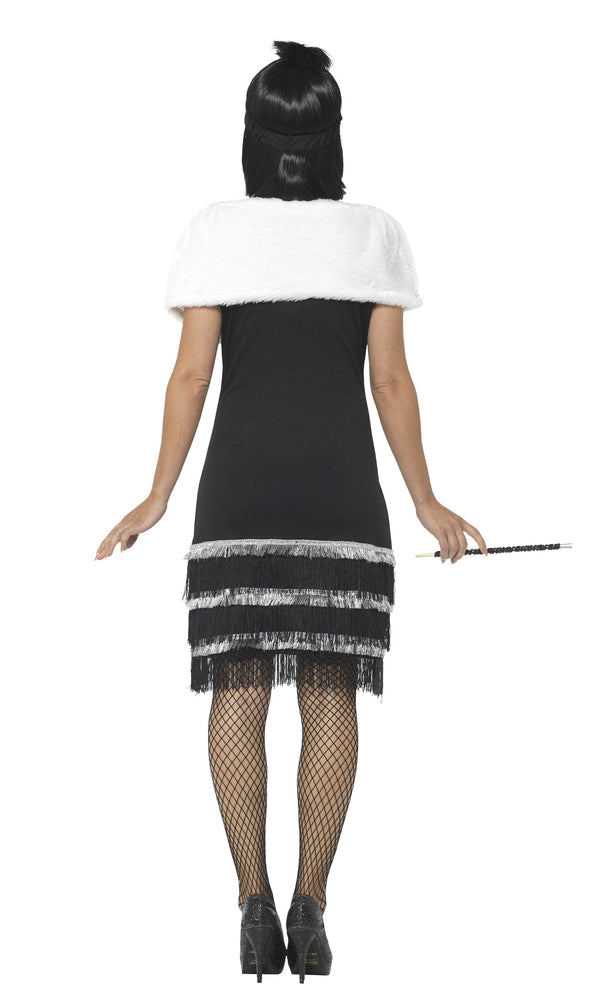 Back of black flapper dress with silver trim, white fur stole and black headband