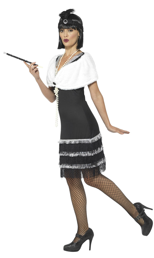 Side of black flapper dress with silver trim, white fur stole and black headband