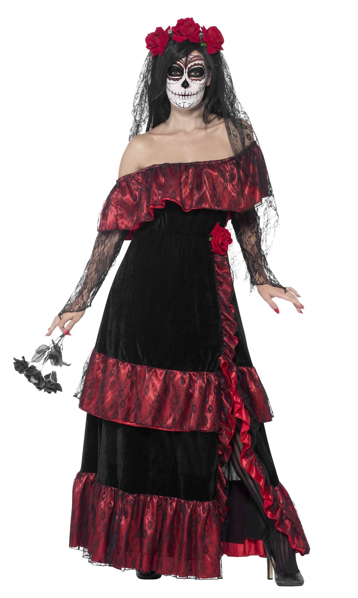 Woman wearing a black and red dress with floral headpiece on a white background