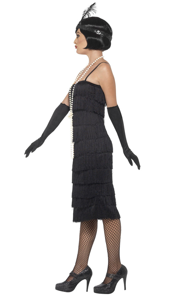 Side of long black tassel flapper dress with headpiece and gloves