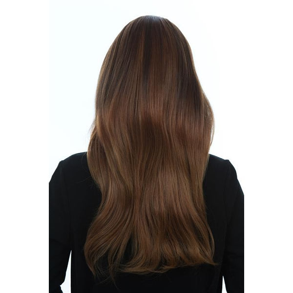 Back of a woman wearing a brown Melania Trump style wig