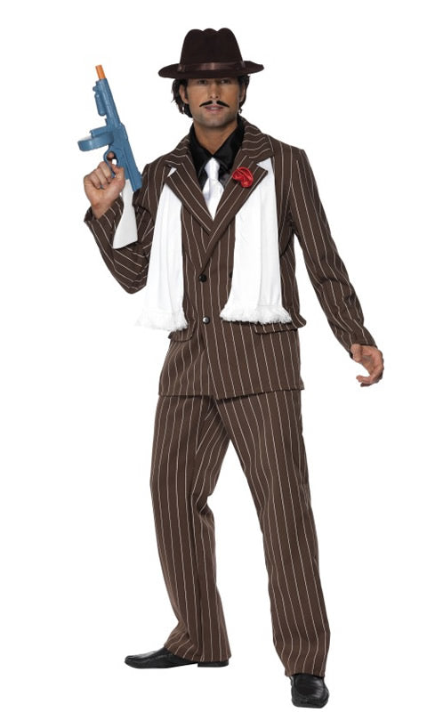 A man in a pin striped brown gangster suit wearing a white scarf and  hat
