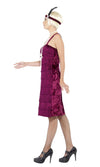Side of knee length maroon flapper dress with tassels on front and headband
