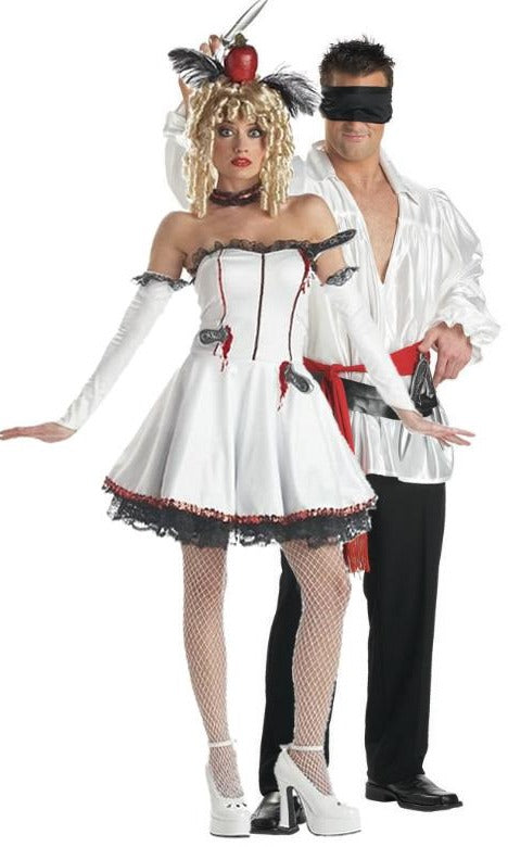 Knife throwers assistant dress next to knife thrower guy