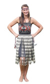 A woman wearing a Kiwiana Maori Kapa Haka dress, poi and headband.