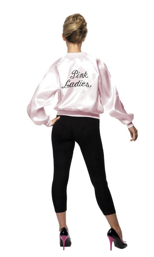 Back of a woman wearing a silky pink ladies Grease jacket with logo stating Pink Ladies